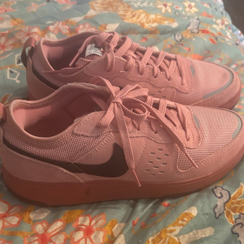 Nike Women’s Pink Low-Top Sneakers with Black Swoosh
